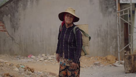 elderly woman farmer in rural vietnam