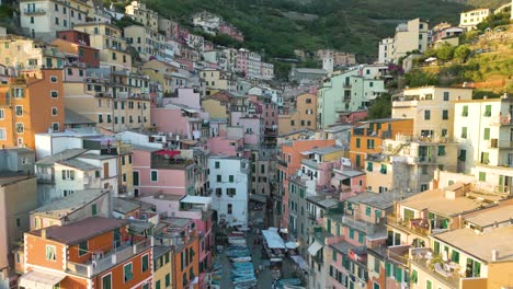 aerial pullback reveals rocky coastline at riomaggiore in cinque terre