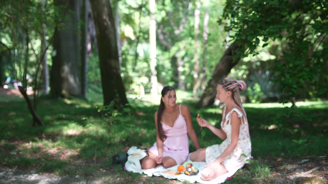 Two women having a picnic in the park