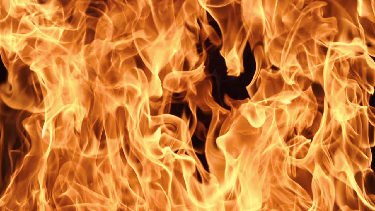 Flames of fire on black background in slow motion. Shot on super slow motion camera 1000 fps.