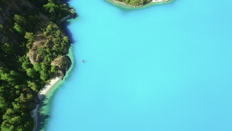 aerial - turquoise waters of general carrera lake, chile, wide shot top down