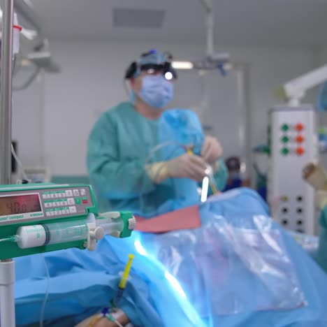 equipment in modern operating room. close up. doctors perform the operation at the background