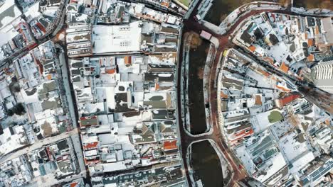 aerial - utrecht, netherlands in a snowy winter, drone shot directly above