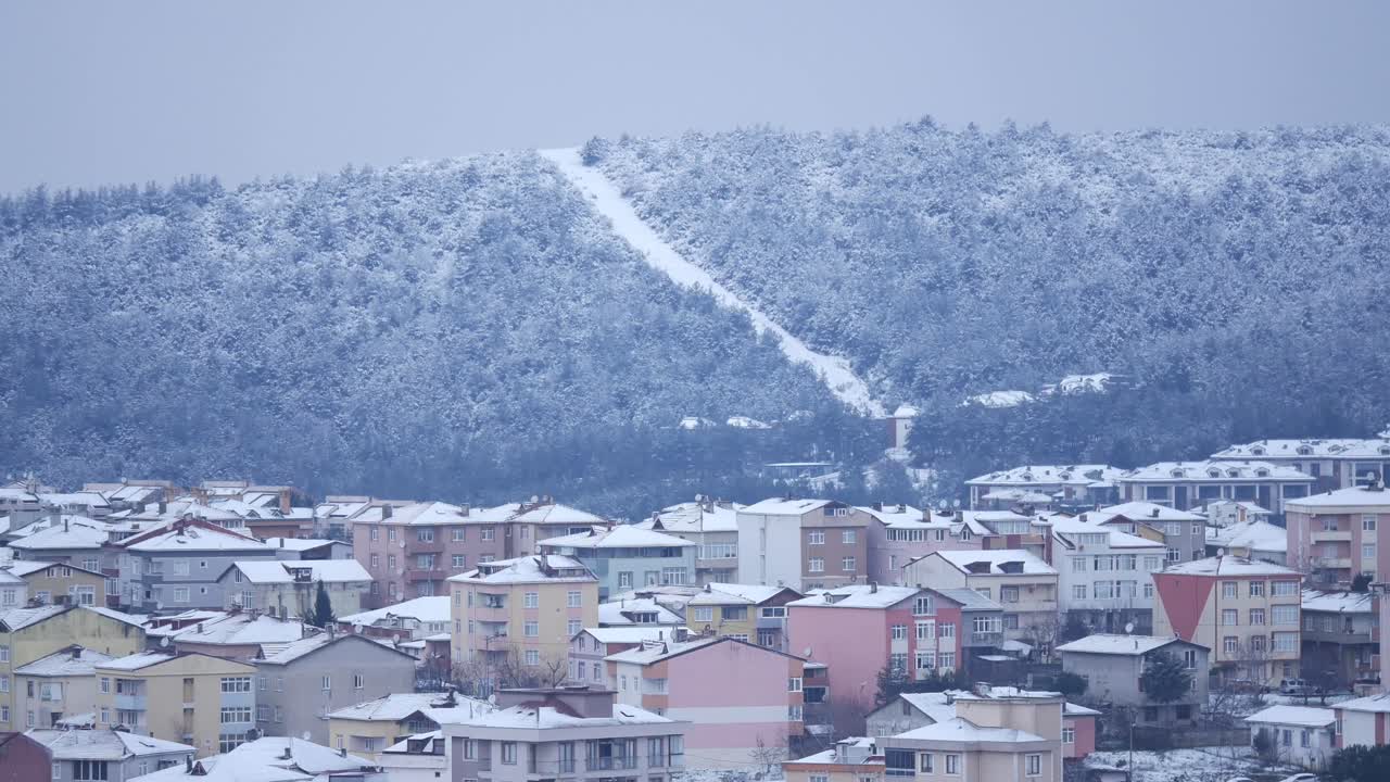Snowy Town Landscape with a Hill