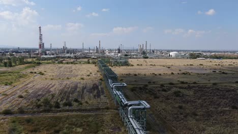 stabilized aerial shot of the steam pipes of a refinery