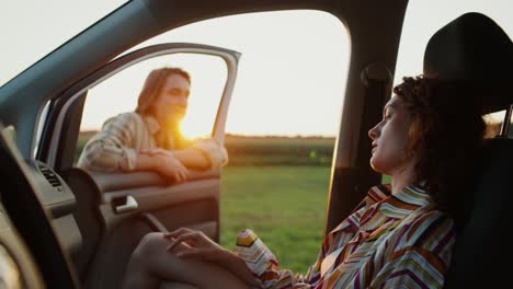 couple enjoying a sunset road trip