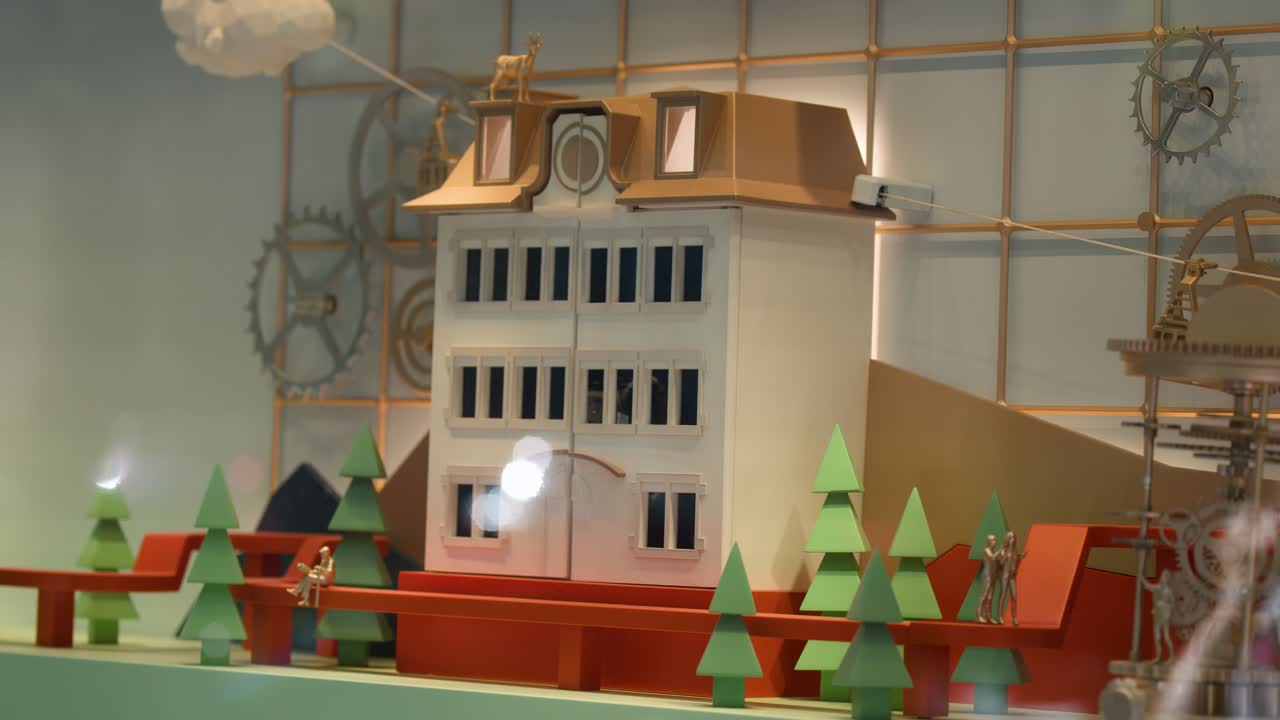 Miniature building clock opens to reveal moving mechanical figure, bright lighting, whimsical showcase, static camera