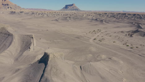 drone over steep bentonite clay hills in utah perfect for off-roading