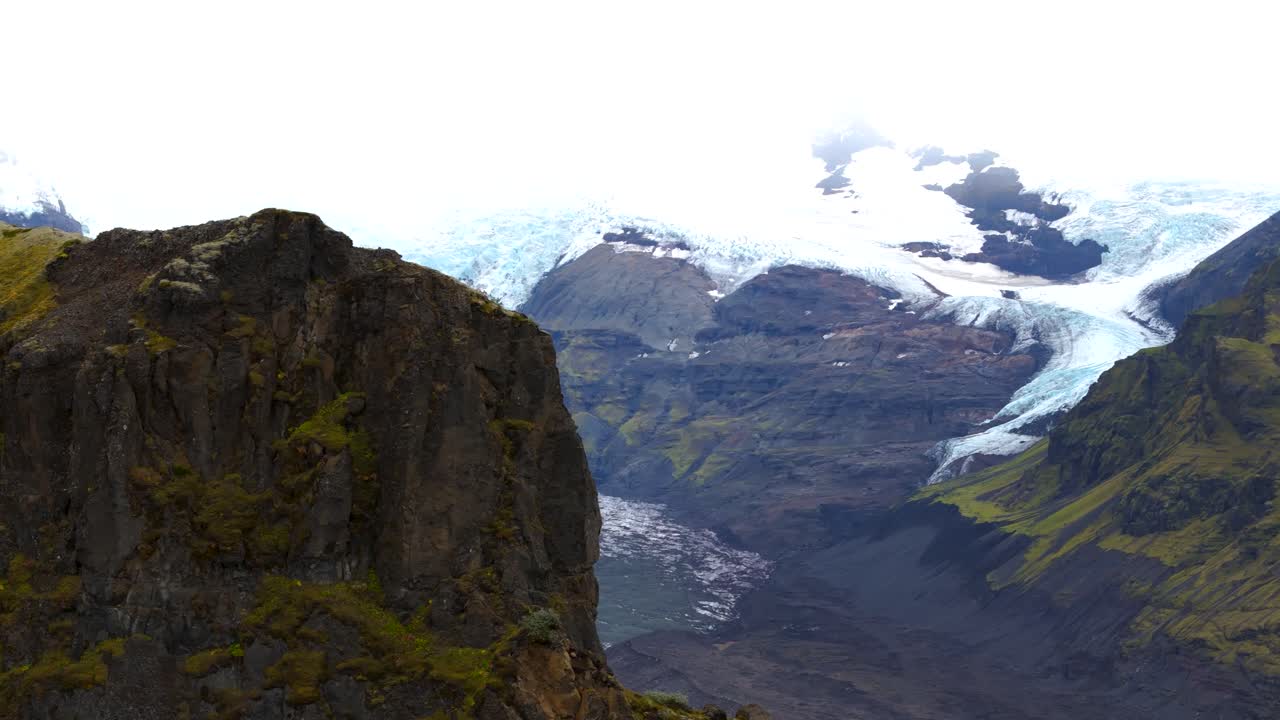 Discovery of the Vatnaj&ouml;kull glacier from a mountain, view of the long trail of turquoise blue ice