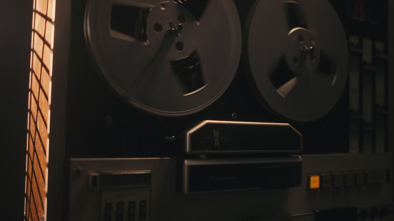 A vintage tape recorder in a pulsing light
