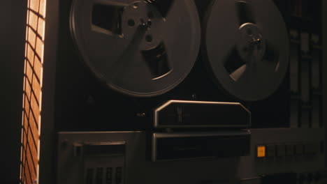 a vintage tape recorder in a pulsing light