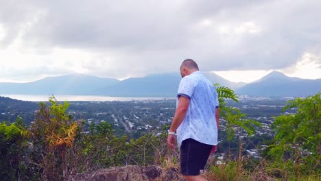 man-wlakinig-in-from-right,-taking-a-break-to-look-at-the-scenary