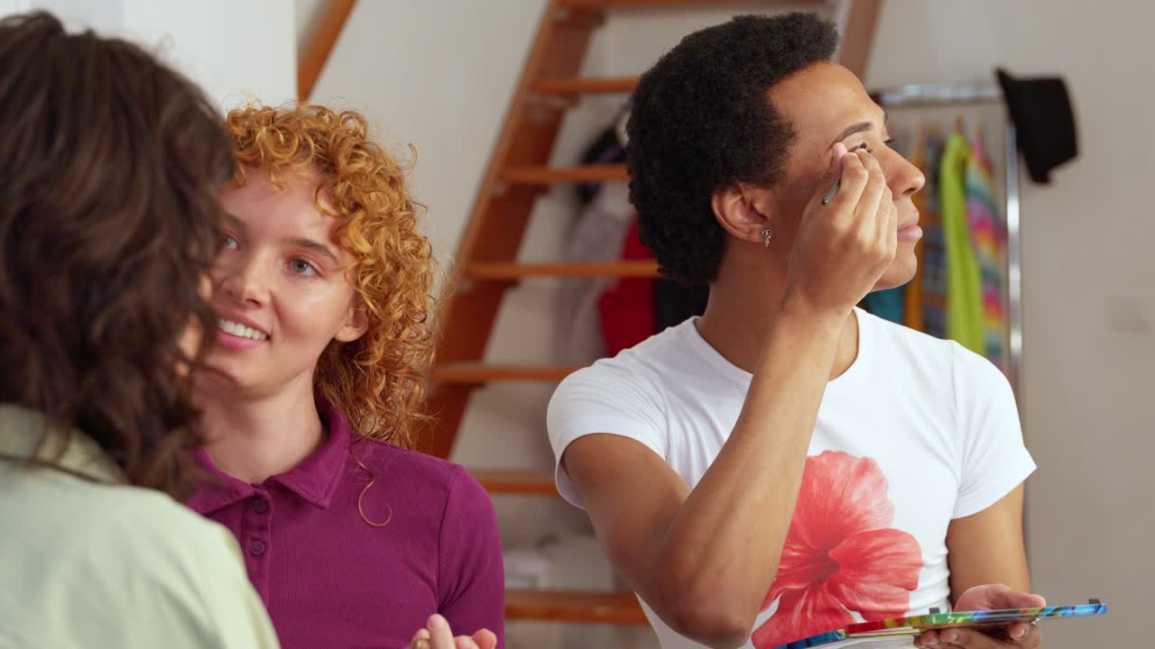 People applying makeup indoors