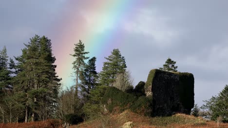 aros castle ruins and a rainbow on the isle of mull, scotland