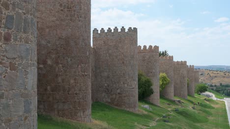 the well-preserved medieval walls of ávila, spain, which encircle the historic old town and are considered among the finest in europe, are part of a unesco world heritage site.