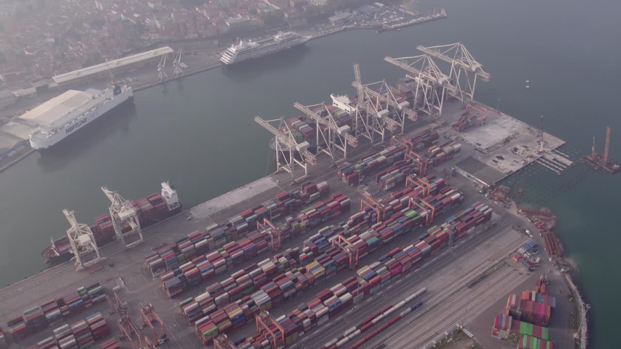 Cranes loading cargo ship at international container port, Koper, Slovenia