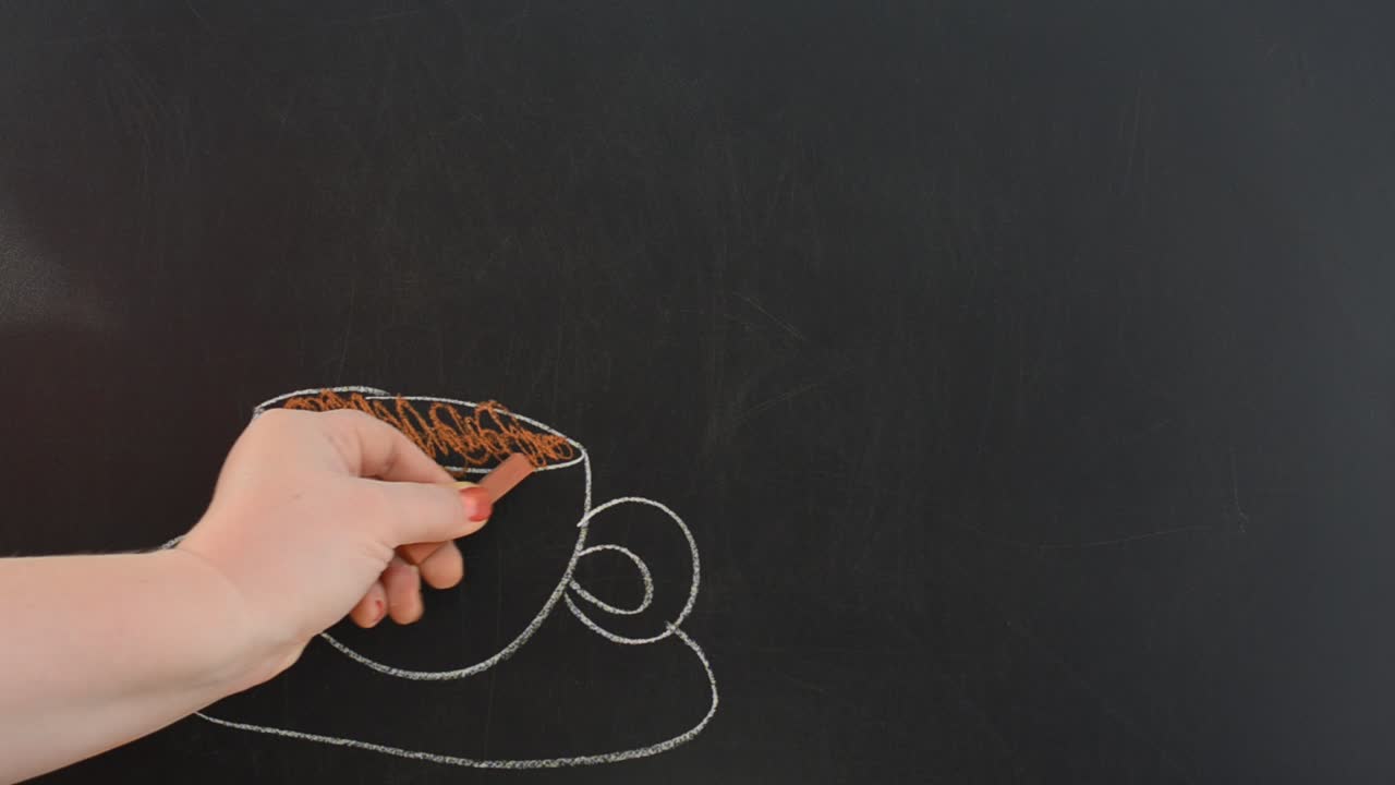 Cup about coffee and coffee grains. We draw chalk on a board