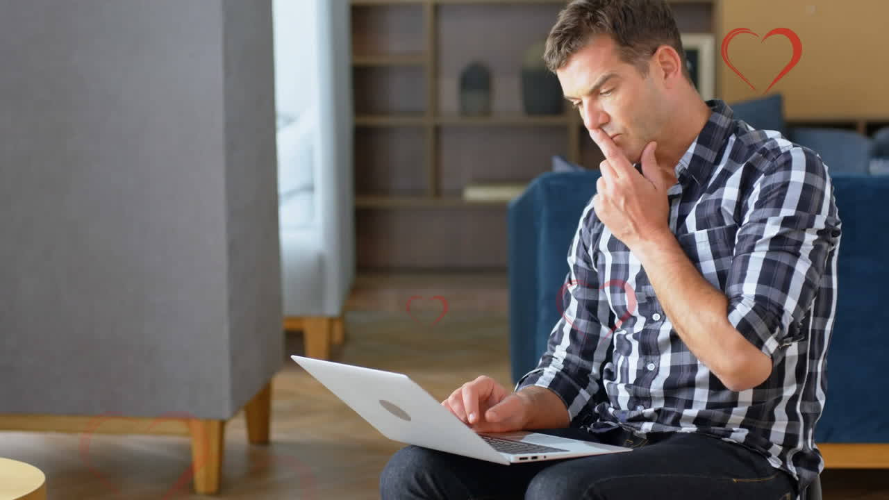 animación de corazones cayendo sobre los hombres usando computadora portátil