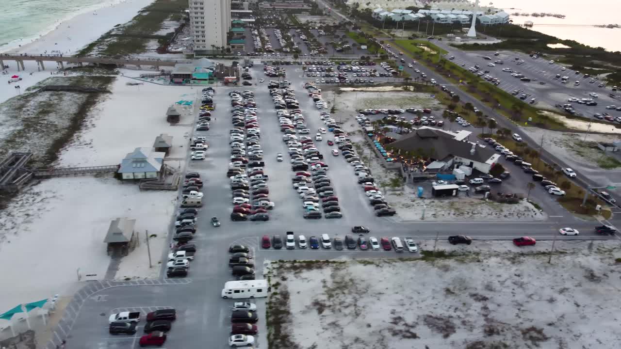 Aerial View of Beach Parking Lot and Coastal Town