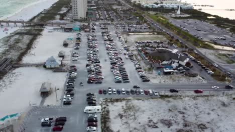 aerial view of beach parking lot and coastal town