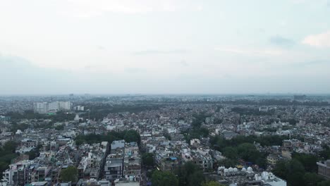 4k aerial shots of new delhi residential suburbs on a beautiful day gliding over rooftops, streets, parks and markets in india