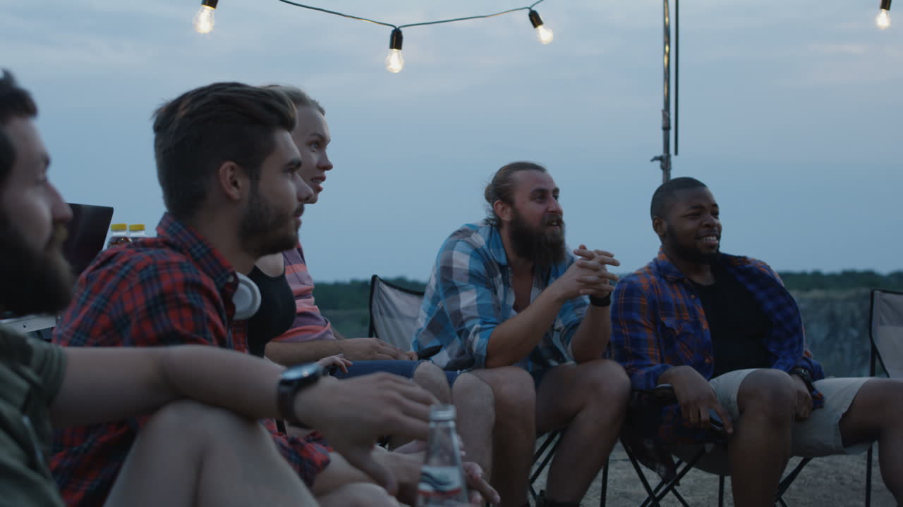 Friends Camping at Night