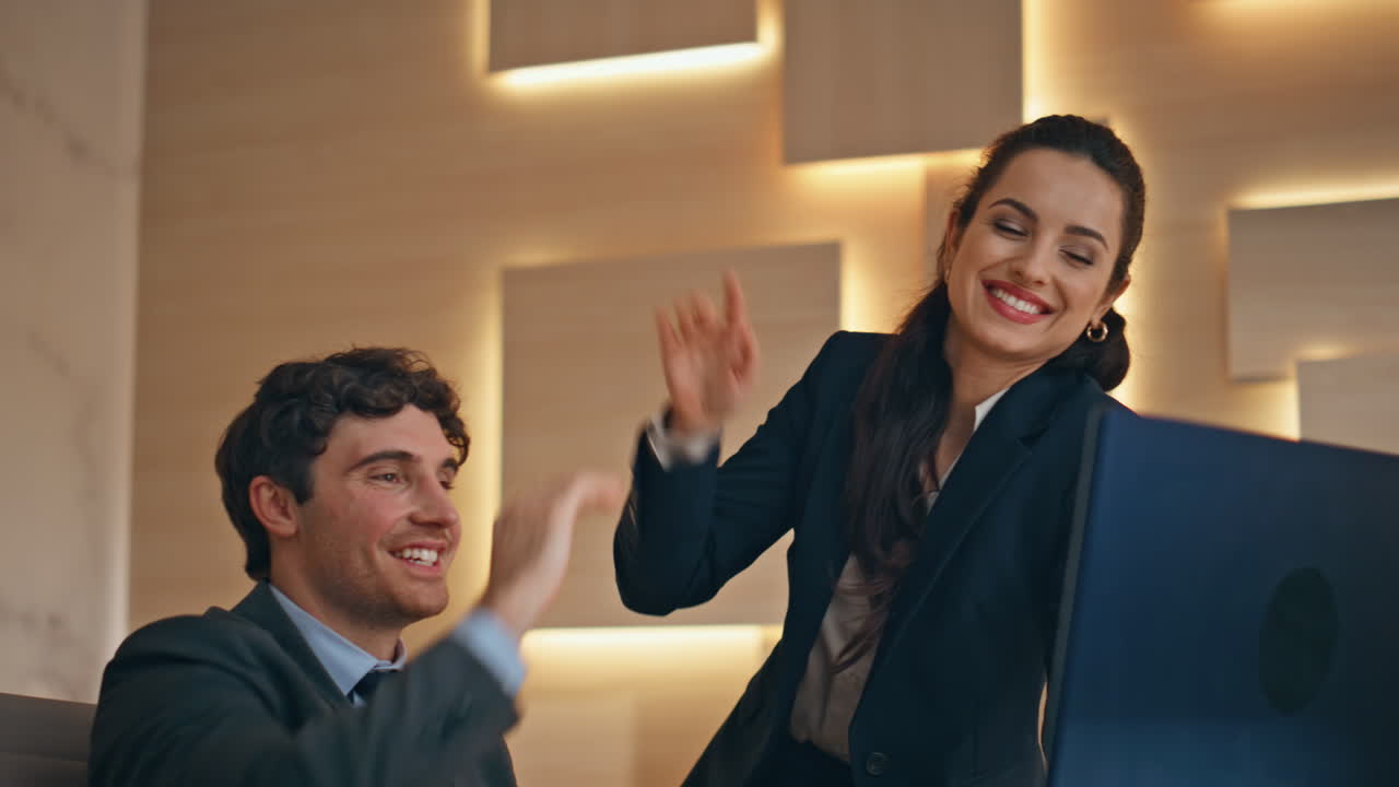 Happy colleagues surprised win celebrating in office closeup. People giving five