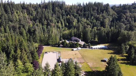 Drone-flight-over-a-beautiful-farm-in-the-middle-of-the-forest-in-washington