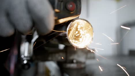 close shot of a radial saw cutting a steel pipe