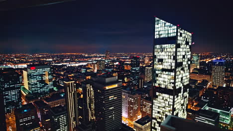 night view of a city with rooftop bar
