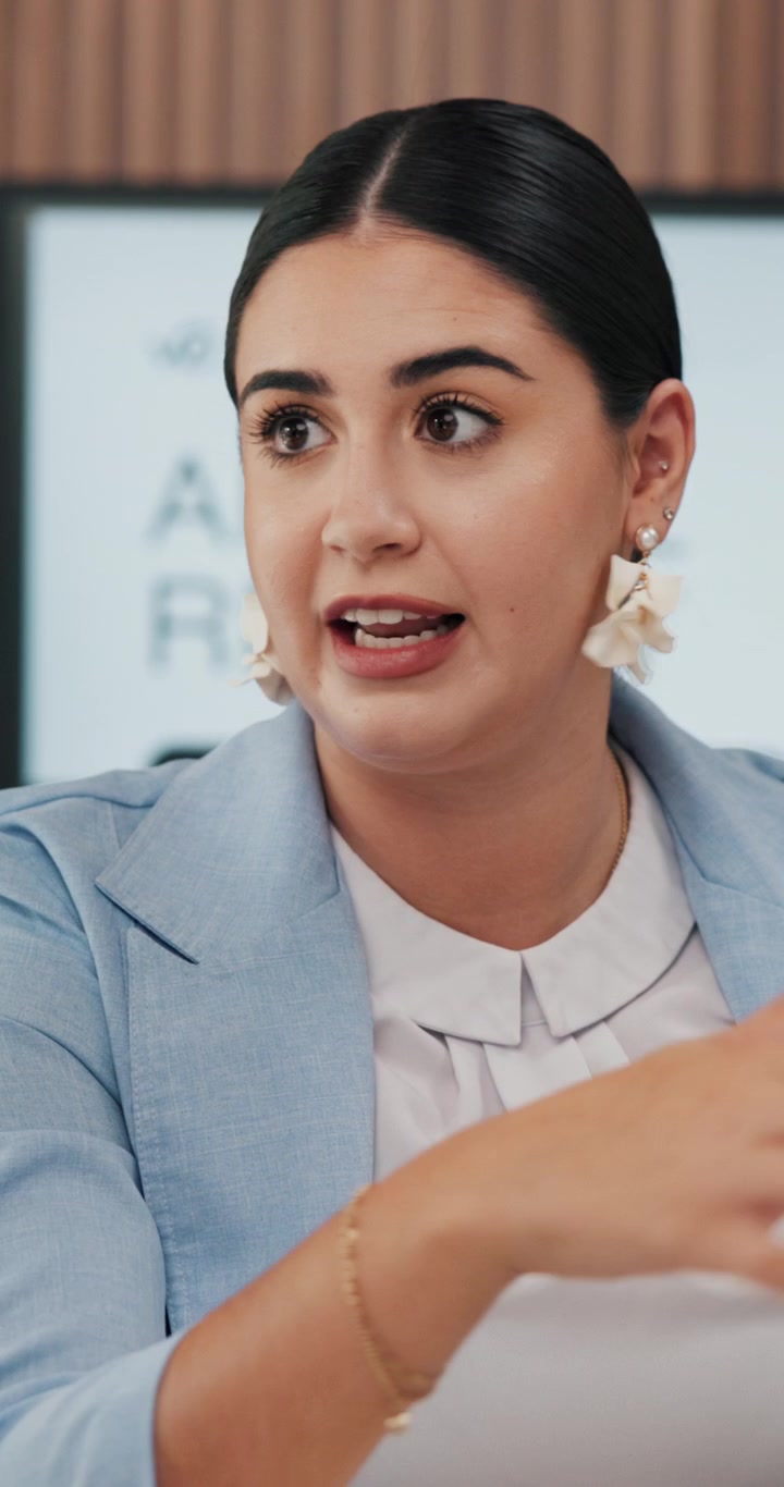 Professional Woman Discussing Business Strategy in Office Meeting