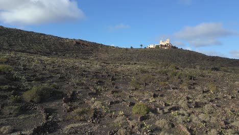 Single-lonely-luxury-mansion-on-black-volcano