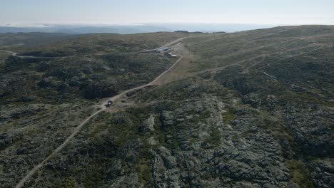 Drone-flying-over-Serra-da-Estrela-Tower,-Portugal