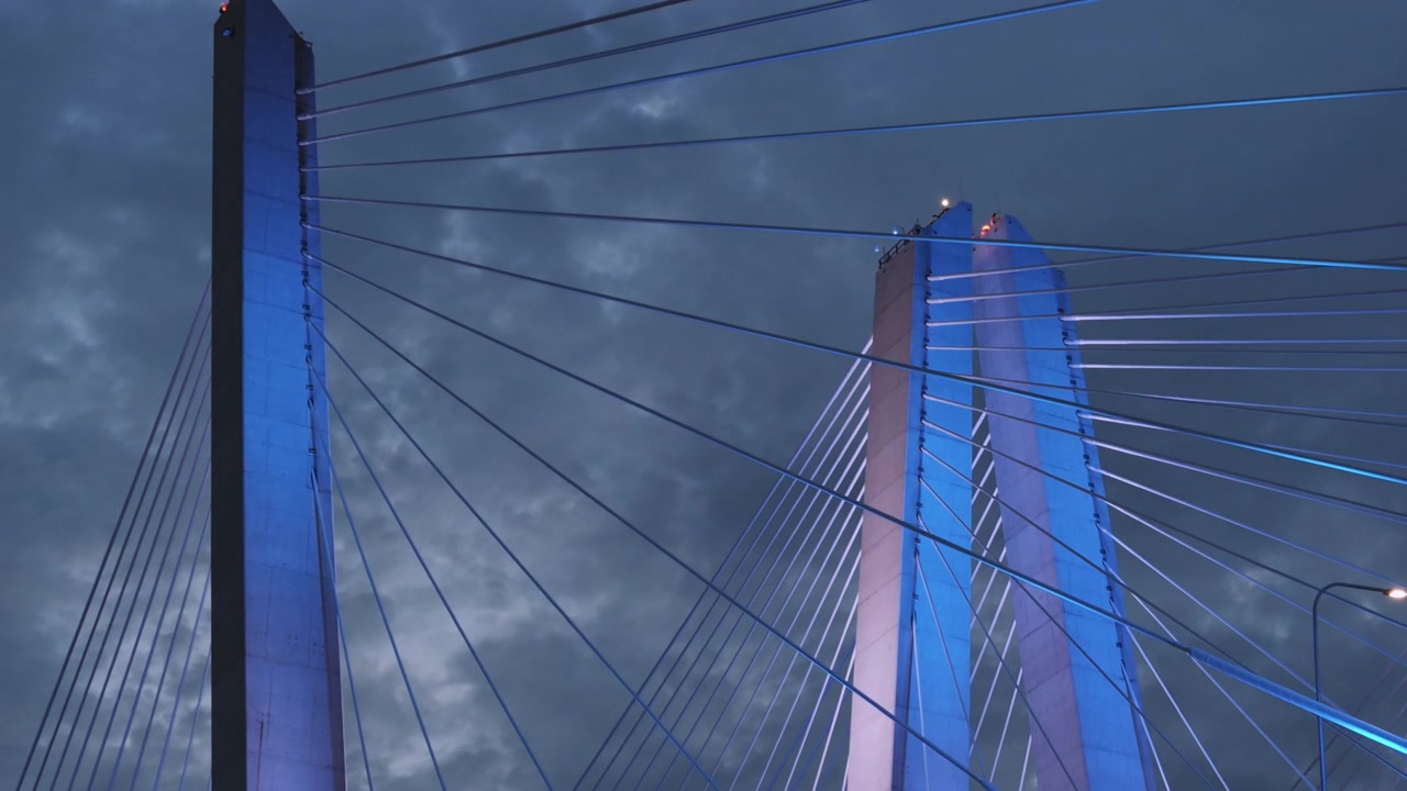The Tappan Zee Bridge crossing The Hudson River at night. Shot on an overcast day during the summer.