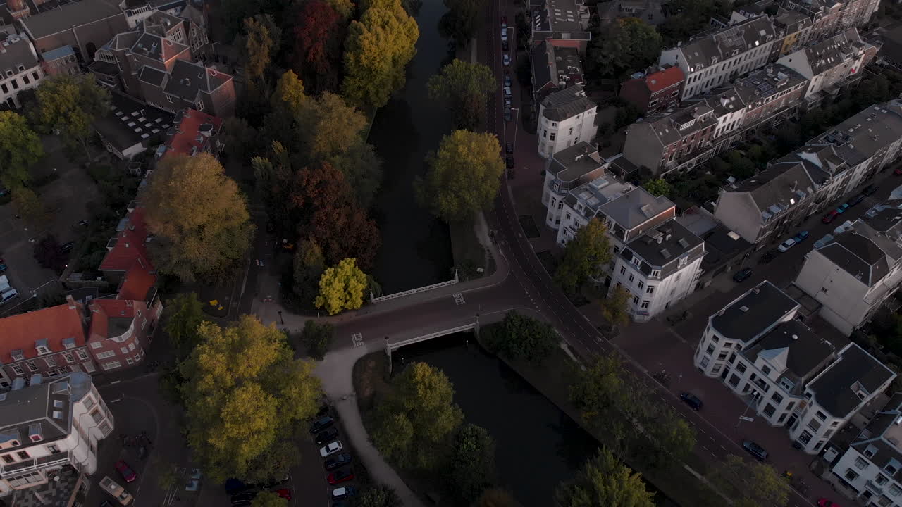 Aerial view of a bridge in the medieval Dutch city of Utrecht revealing the wider cityscape at early morning sunrise