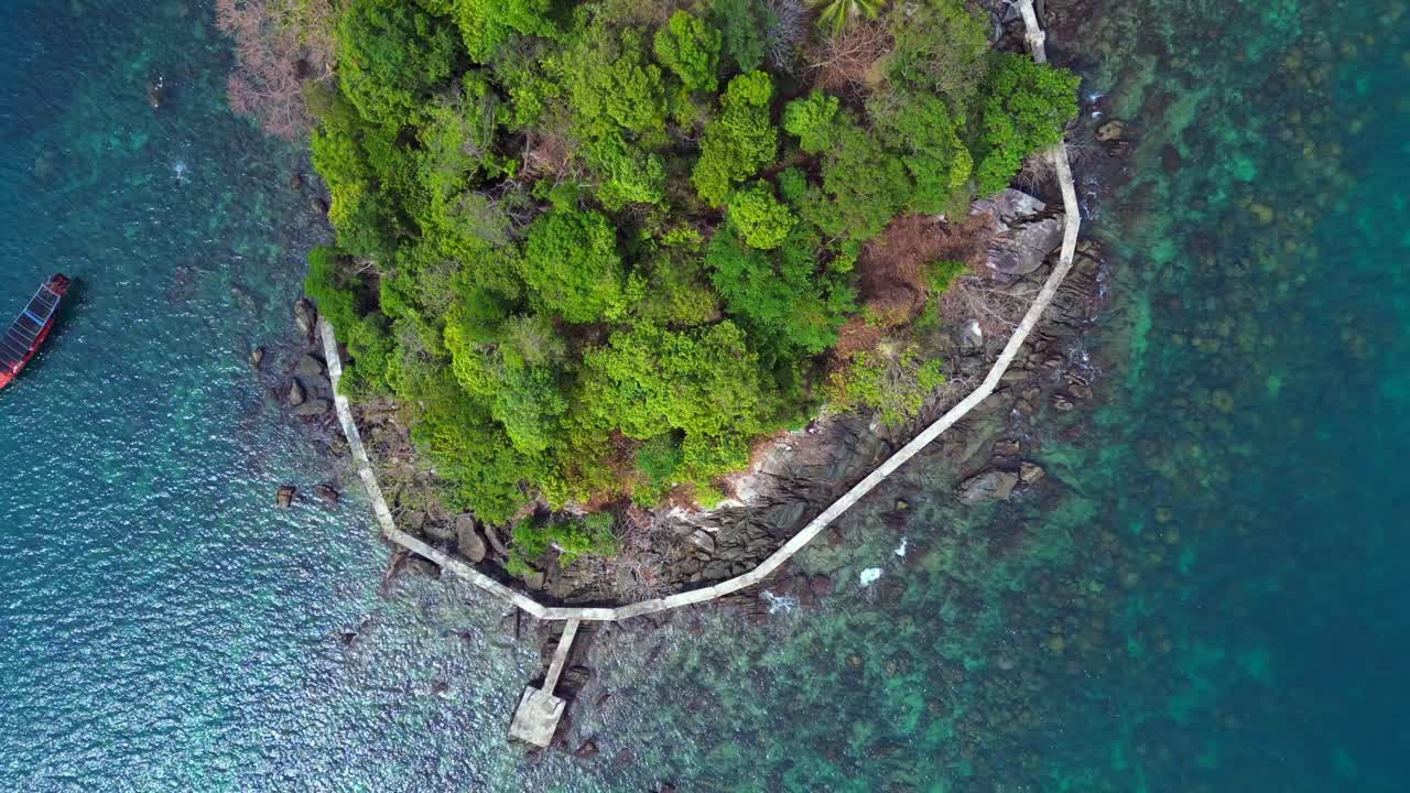 Tourist boats surrounding tropical Koh Toch Island near Sihanoukville, Cambodia. Fabulous aerial view flight vertical bird's eye view drone