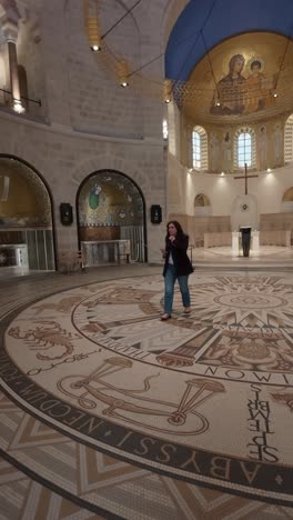 Woman Tourist Admiring Dormition Abbey's Interior. Slow motion.