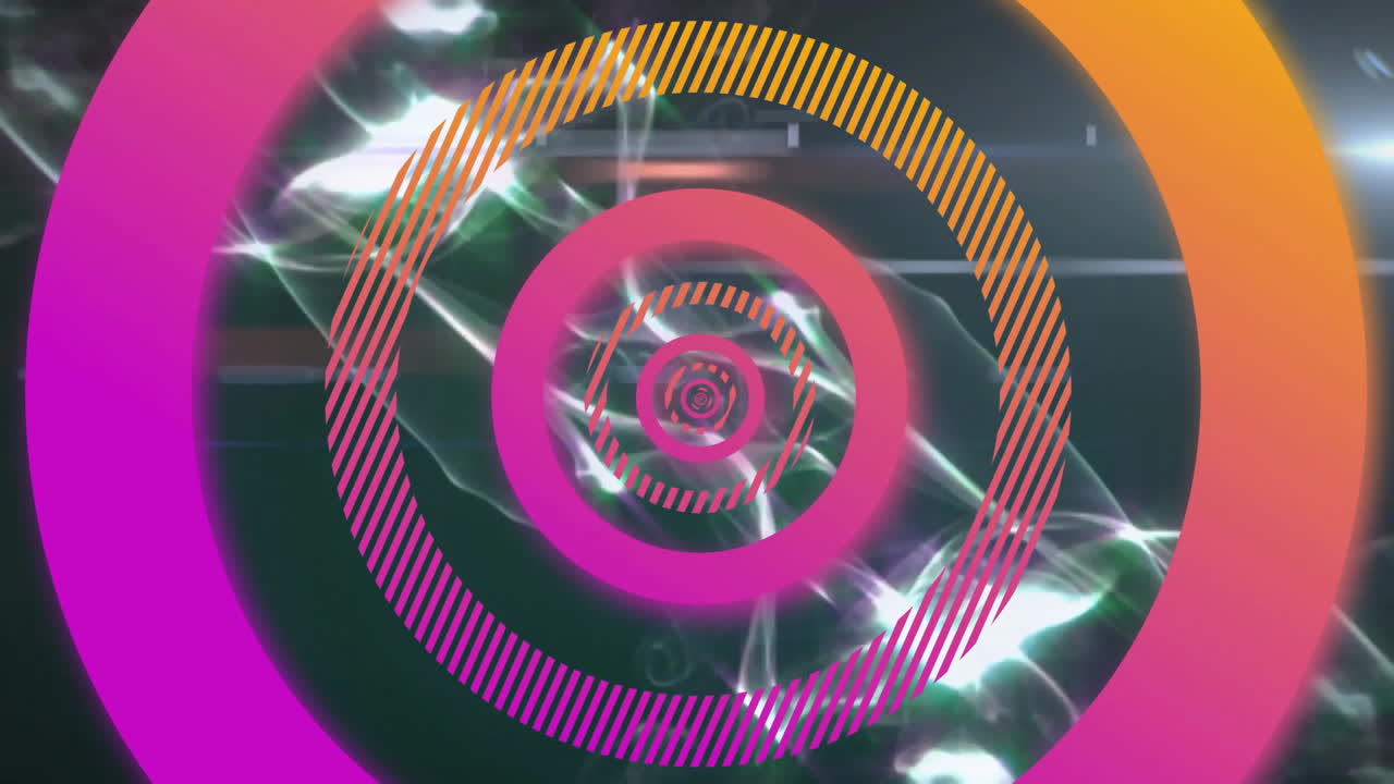 Animation of pink circles over light trails on black background