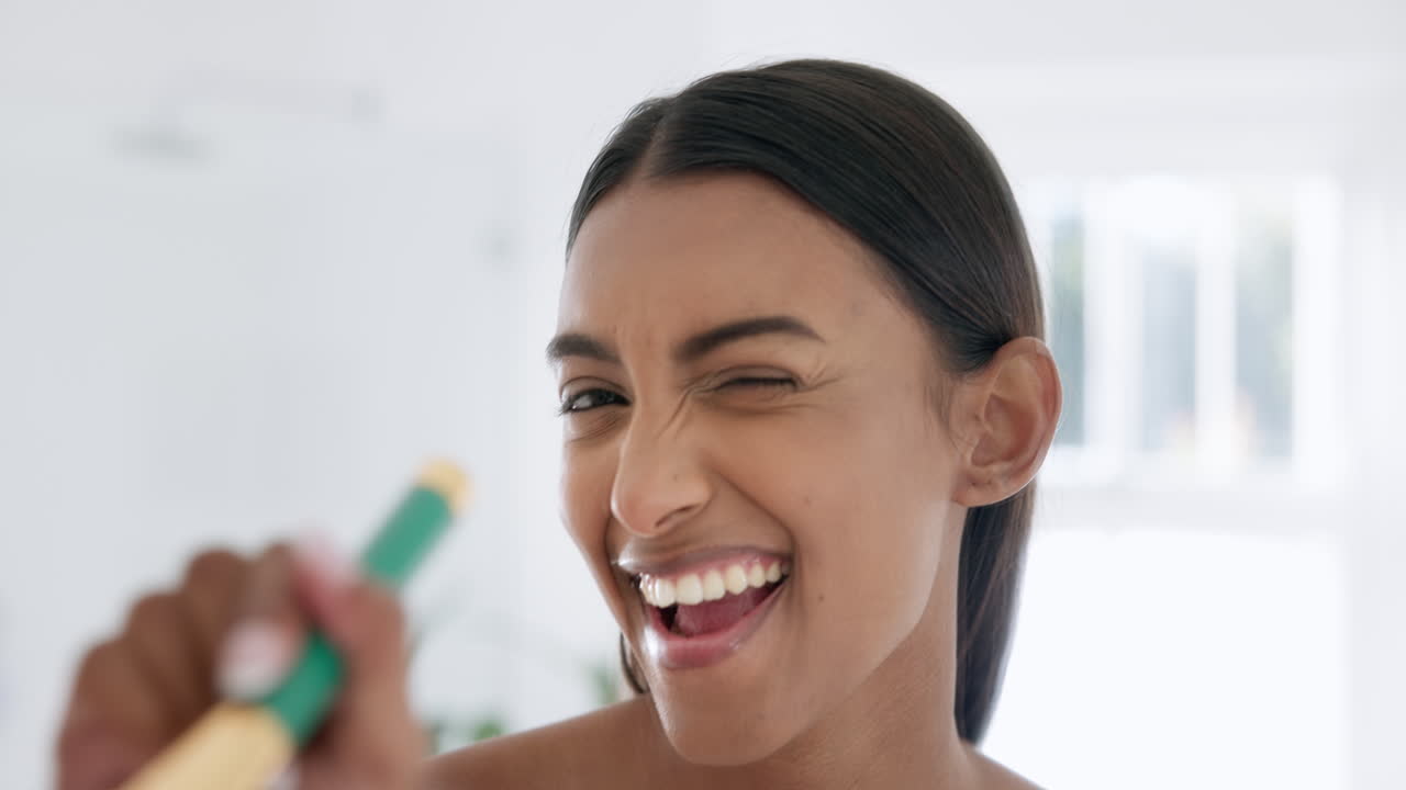 Makeup, cosmetic and face of woman in the bathroom