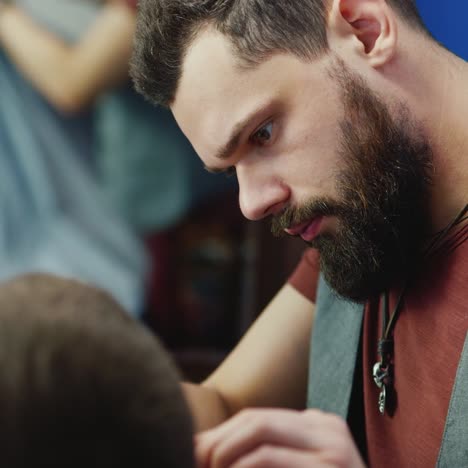 Close-Up-Of-Barber-Working-On-Client's-Hair-And-Beard-05