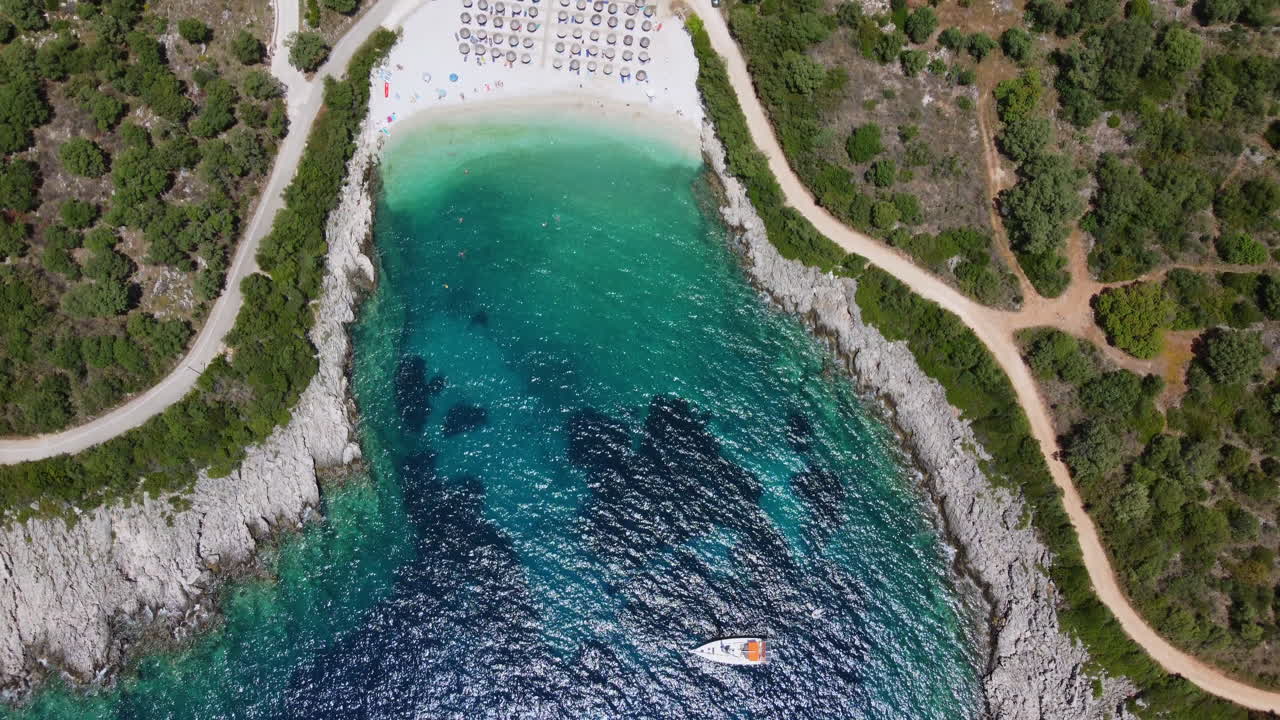 Aerial view of Ammousa Beach with a sailing boat