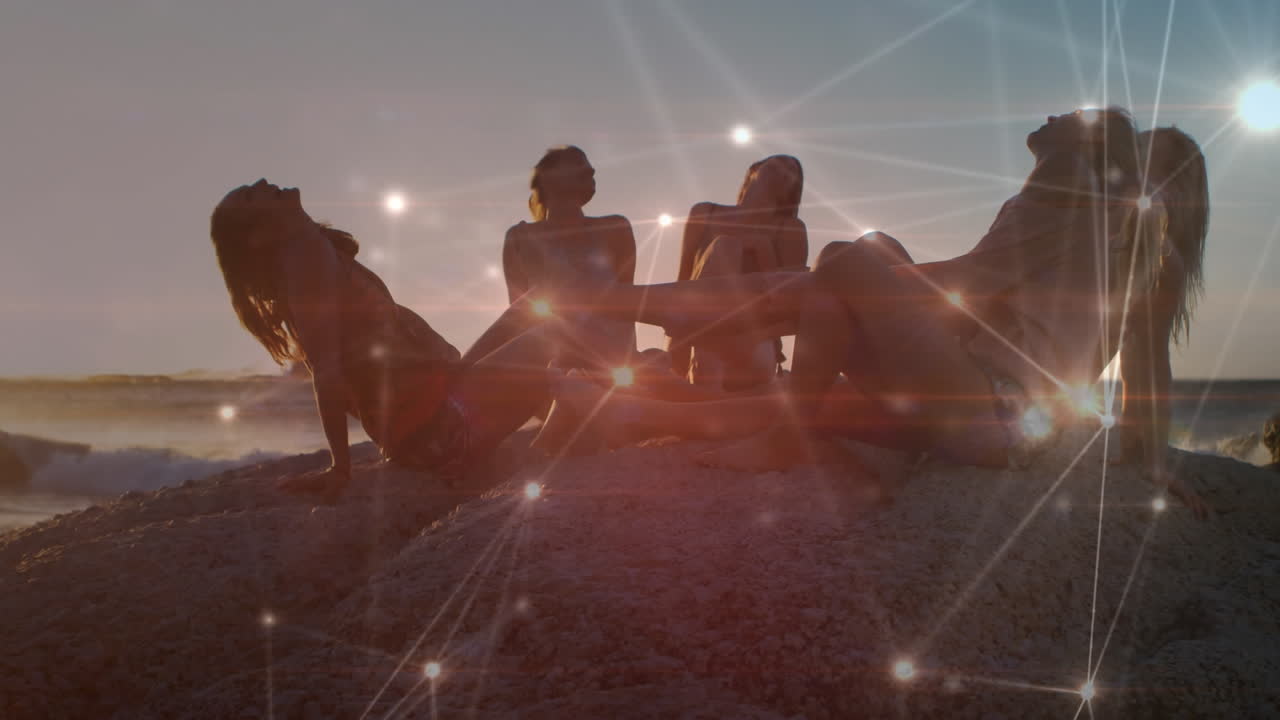 ⁇ 은 해변에서 웃고 있는 여성 친구들 위에 반 ⁇ 이는 커뮤니케이션 네트워크의 애니메이션