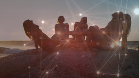 animación de una red de comunicación brillante sobre amigas riendo en una playa soleada