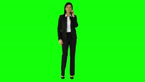 Businesswoman-having-phone-call-on-green-screen-