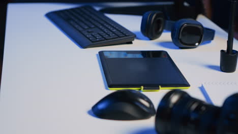 close up shot of photography studio desk with professional camera, graphic tablet