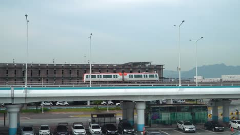 busan-gimhae lrt train arriving at gimhae international airport in gangseo district, busan, south korea