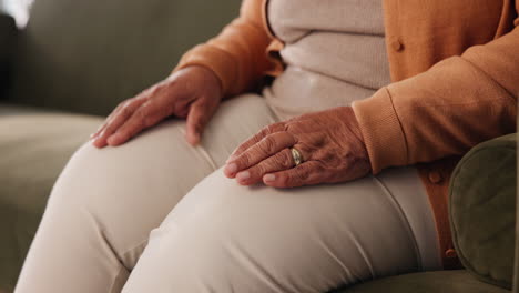 close-up of elderly woman's hands and knee