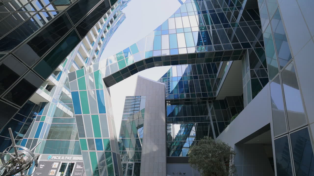 Modern Urban Architecture with Striking Glass Facades and Sculpture