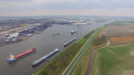 cargo ships at the port of terneuzen, netherlands, going to ghent in belgium