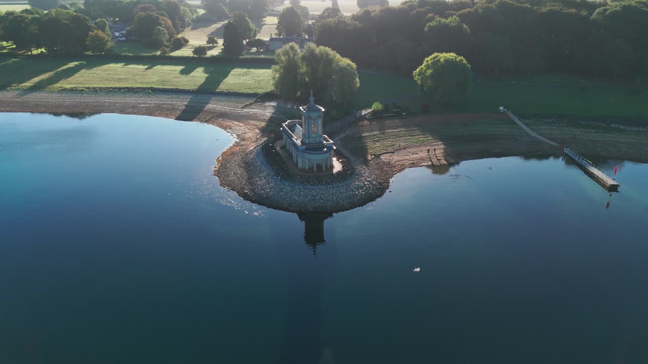 Normanton Church Rutland Water iconic landmark located on the shore, England aerial drone